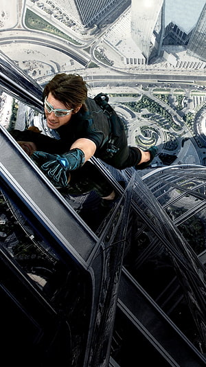 Ethan Hunt scaling the Burj Khalifa in Mission Impossible Ghost Protocol HD phone wallpaper