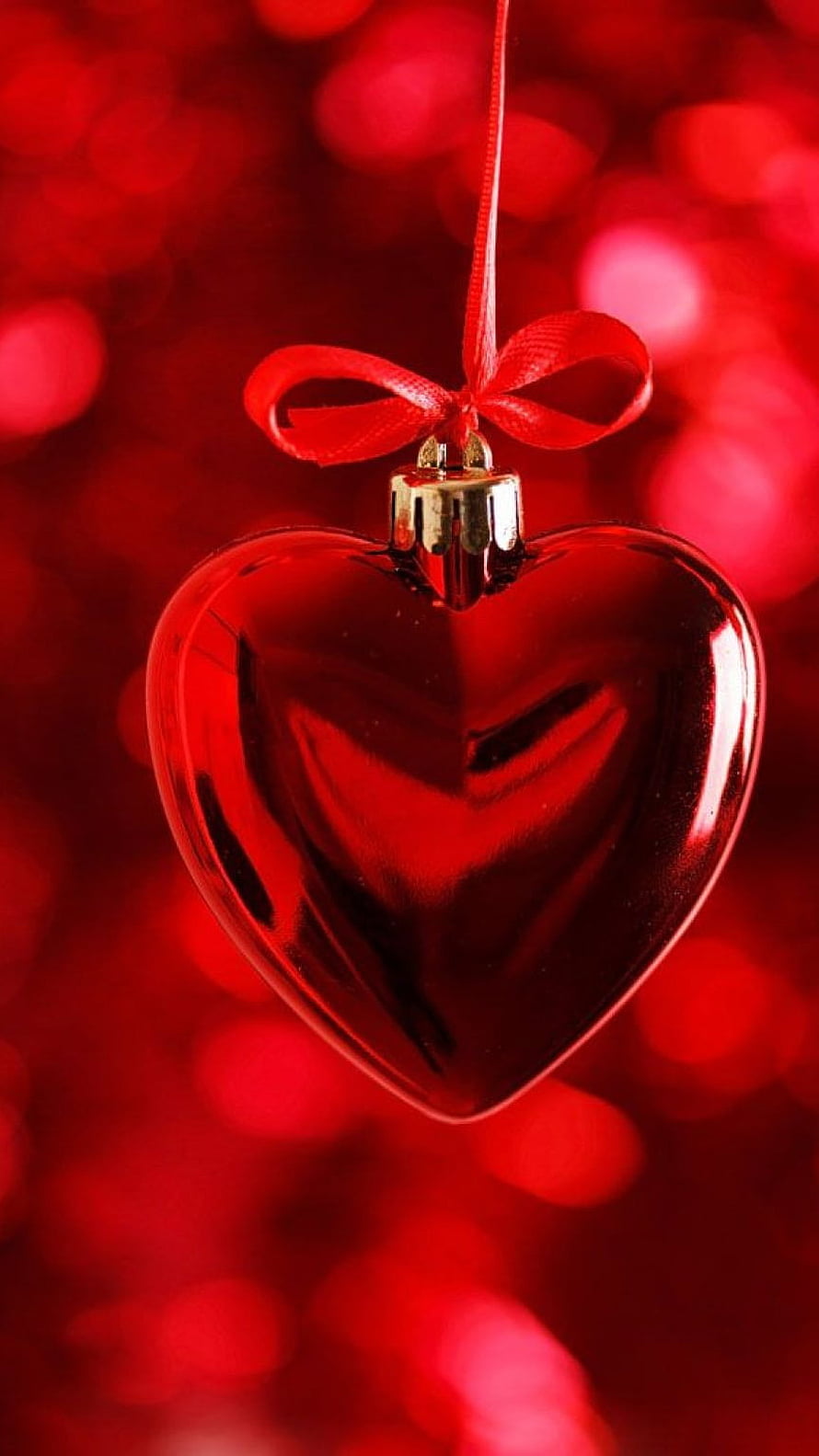Glossy Red Heart Ornament with Ribbon Against Bokeh Background HD phone wallpaper
