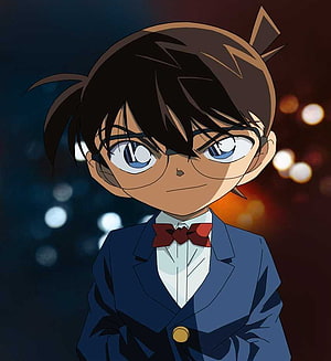 Conan Edogawa in a Blue Suit with Red Bow Tie and Glasses Against a Bokeh Background HD phone wallpaper