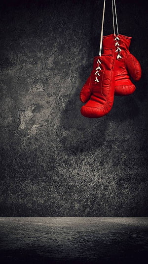 Red Boxing Gloves Hanging Against Dark Grunge Wall HD phone wallpaper