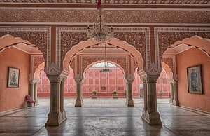 Ornate Pink Palace Interior with Arched Columns and Chandeliers in Jaipur HD wallpaper