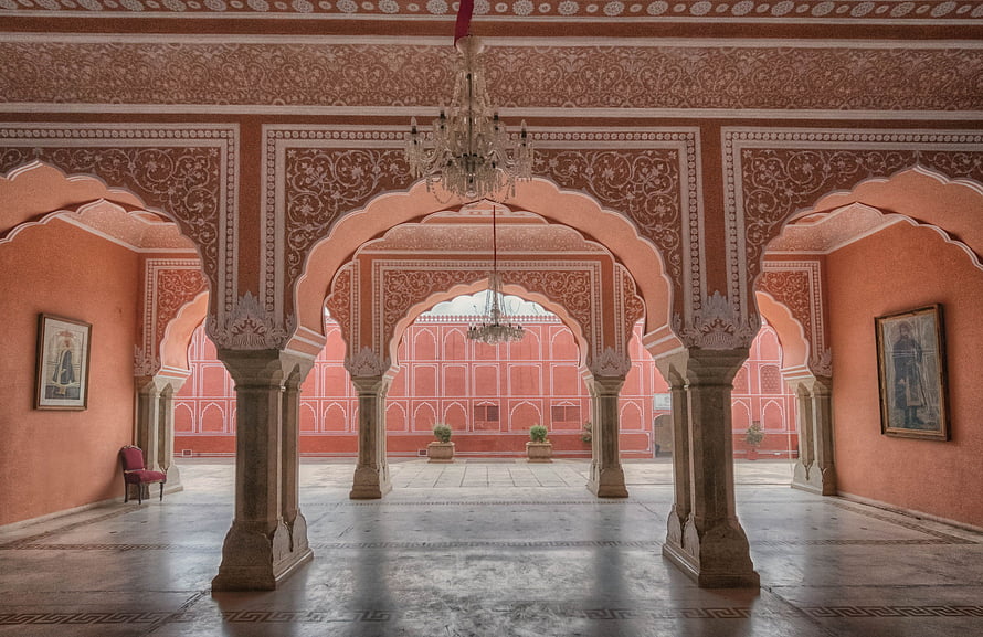 Ornate Pink Palace Interior with Arched Columns and Chandeliers in Jaipur HD wallpaper