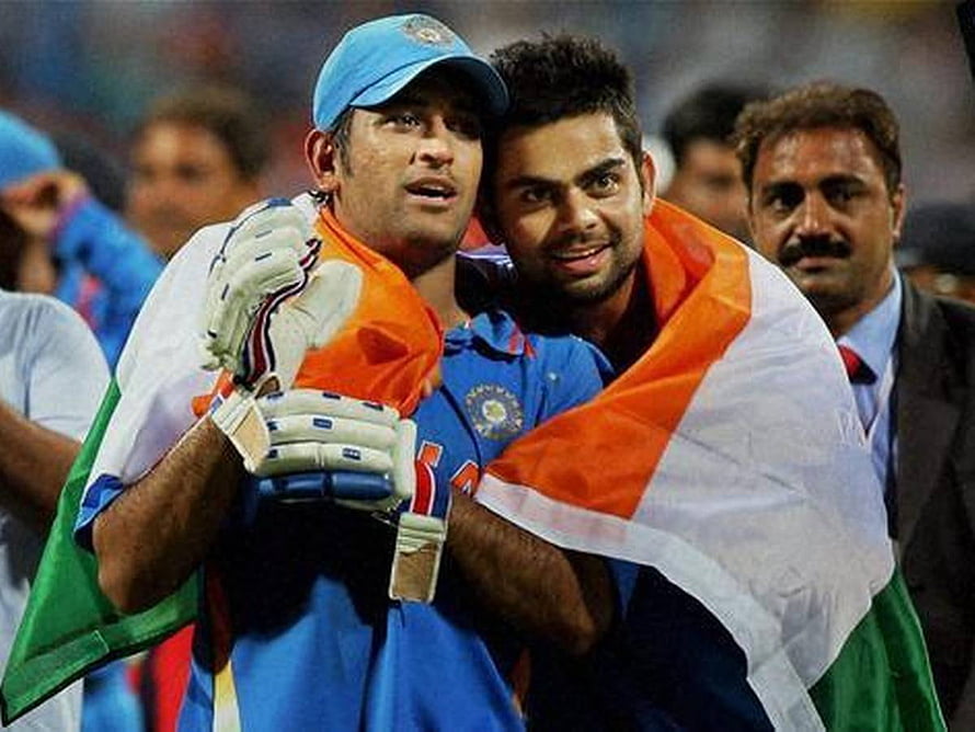 Virat Kohli and MS Dhoni Celebrating with Indian Flag in Cricket Uniform HD wallpaper