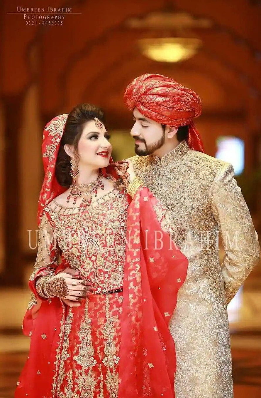 Elegant Indian Bridal Couple in Traditional Red and Gold Wedding Attire HD phone wallpaper