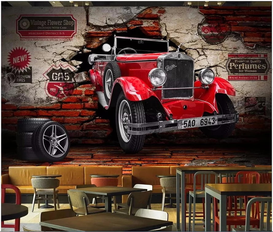 Vintage red classic car mural on distressed brick wall in modern cafe interior HD wallpaper