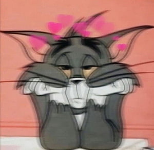 Tom from Tom and Jerry in a dreamy aesthetic pose with floating pink hearts HD wallpaper