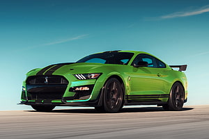 Ford Mustang Shelby GT500 in Vibrant Green with Black Racing Stripes HD wallpaper