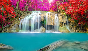Vibrant Autumn Waterfall Cascading Into Turquoise Pool Surrounded By Red And Pink Foliage HD wallpaper