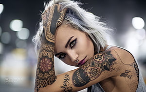 Portrait of a woman with platinum hair and intricate full sleeve tattoos HD wallpaper