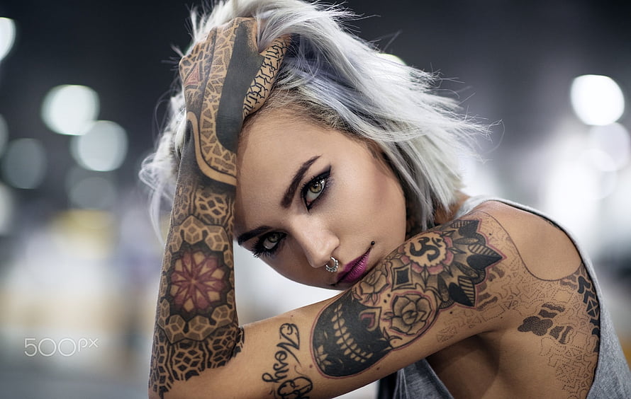 Portrait of a woman with platinum hair and intricate full sleeve tattoos HD wallpaper