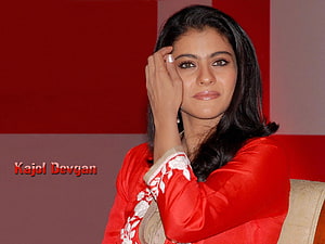 Kajol Devgan in a red embroidered kurta with a soft, contemplative expression HD wallpaper