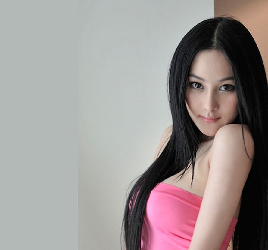 Portrait of Zhang Xinyu in a Pink Strapless Dress with Long Black Hair HD wallpaper
