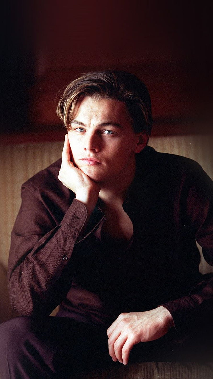 Young Leonardo DiCaprio Pensive Portrait in Dark Shirt HD phone wallpaper
