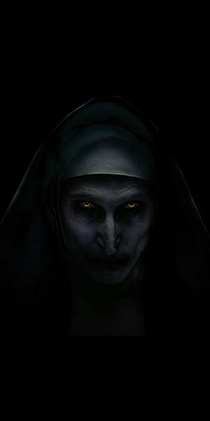 Evil Nun Portrait with Glowing Yellow Eyes in Dark Hooded Horror Style HD phone wallpaper
