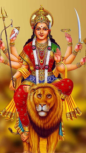Goddess Durga Riding a Lion with Multiple Arms Holding Weapons and Sacred Symbols HD phone wallpaper