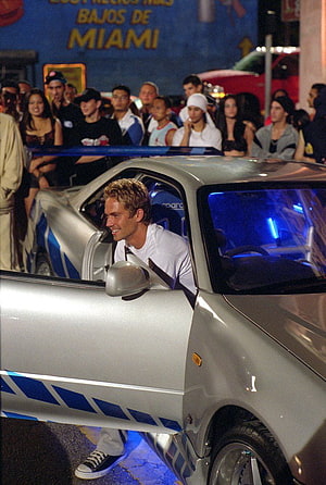Paul Walker in a silver sports car at a nighttime street event from Fast and Furious HD phone wallpaper