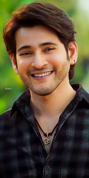 Mahesh Babu smiling portrait in dark plaid shirt with green bokeh background HD phone wallpaper