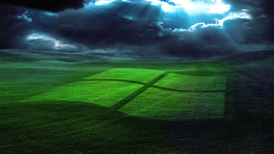 Windows XP Dark Green Hills Wallpaper with Dramatic Stormy Sky and Sunbeams HD wallpaper