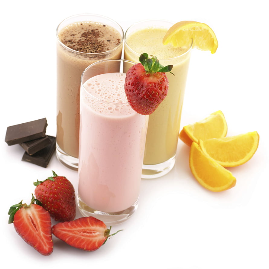 Three colorful fruit smoothies with strawberries, orange slices, and chocolate pieces on a white background HD phone wallpaper