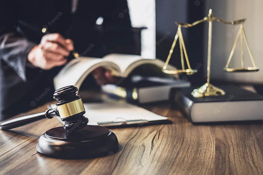 Judge's Gavel and Scales of Justice on a Wooden Desk with Legal Books HD wallpaper