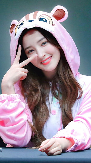 Nancy from Momoland in a pink animal hooded onesie smiling and making a peace sign HD phone wallpaper