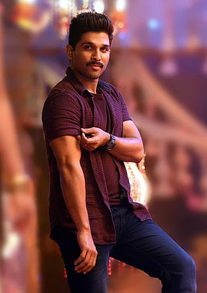 Allu Arjun in a maroon checkered shirt with a confident pose and warm bokeh background HD phone wallpaper