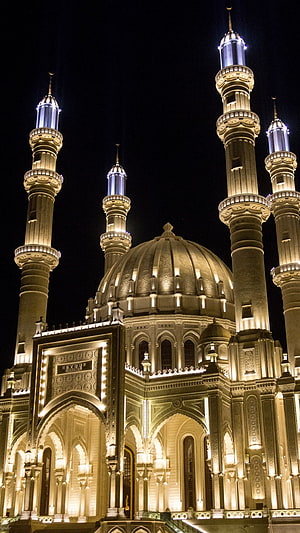 Istiqamah Mosque at Night with Illuminated Minarets and Central Dome HD phone wallpaper