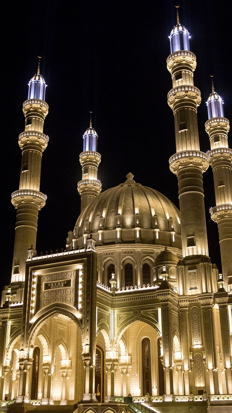 Istiqamah Mosque at Night with Illuminated Minarets and Central Dome HD phone wallpaper