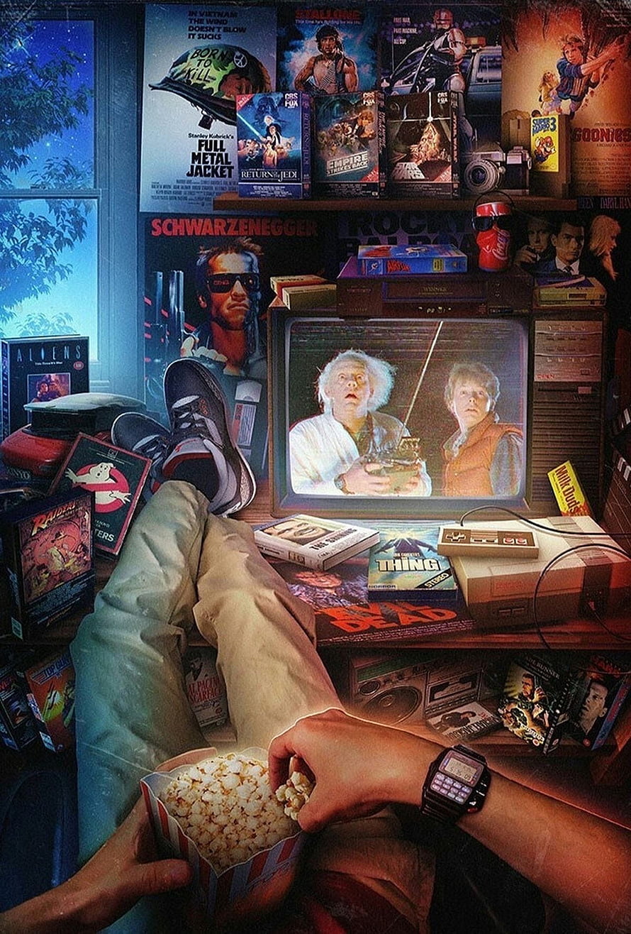 Retro Gaming Nostalgia Scene With Vintage VHS, Arcade Consoles, and Popcorn HD phone wallpaper