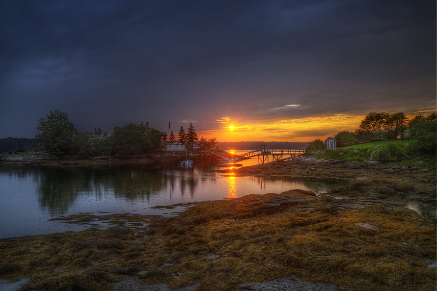 Dramatic Maine River Sunset with Wooden Dock and Seaside Cottage HD wallpaper