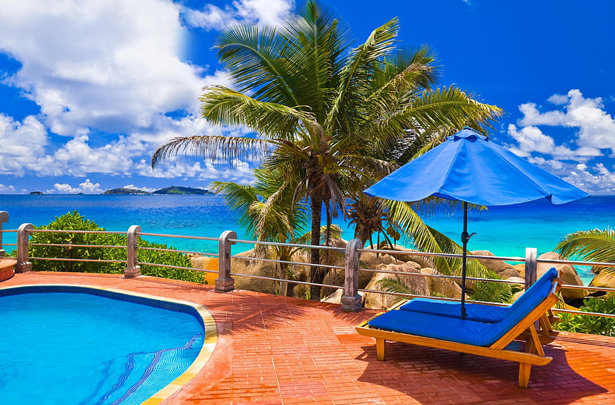 Tropical Poolside Retreat With Blue Umbrella And Ocean View HD wallpaper