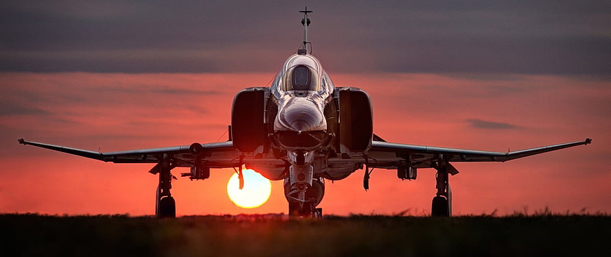 Military Fighter Jet Silhouette on Runway at Sunset HD wallpaper
