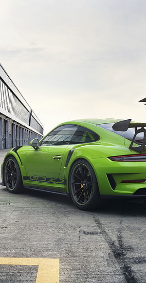 Lime Green Porsche 911 GT3 RS with Large Rear Wing Parked on Concrete HD phone wallpaper