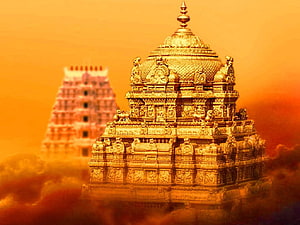 Golden Temple Architecture at Tirumala Hills with Warm Sunset Sky and Misty Clouds HD wallpaper