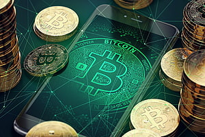 Bitcoin coins and smartphone displaying digital currency network with green circuit board design HD wallpaper