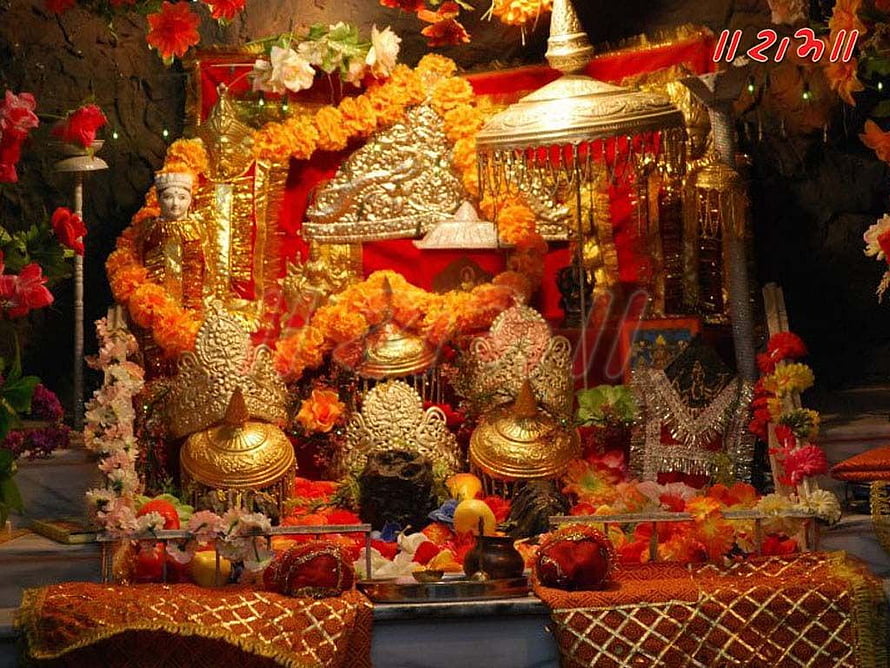 Sri Vaishno Devi Temple Shrine Decorated With Marigold Garlands And Gold Ornaments HD wallpaper