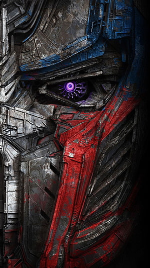 Transformers Autobot Face Close-Up with Glowing Purple Eye and Weathered Red Armor HD phone wallpaper