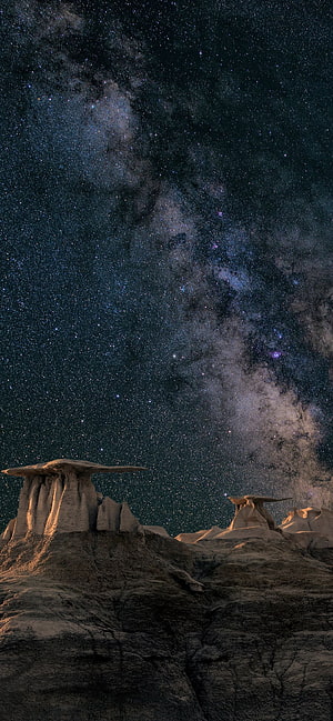 Milky Way Galaxy Arching Over Dramatic Hoodoo Rock Formations at Night HD phone wallpaper