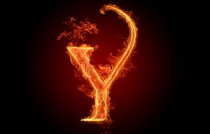Burning Letter Y in Vivid Orange Flames Against a Dark Background HD wallpaper