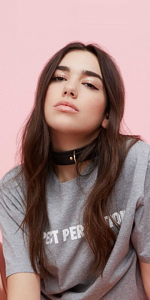 Dua Lipa Portrait in Grey T-Shirt and Black Choker Against Pink Background HD phone wallpaper