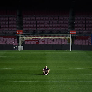 Andres Iniesta Sitting Alone on the Pitch at Camp Nou Stadium HD phone wallpaper