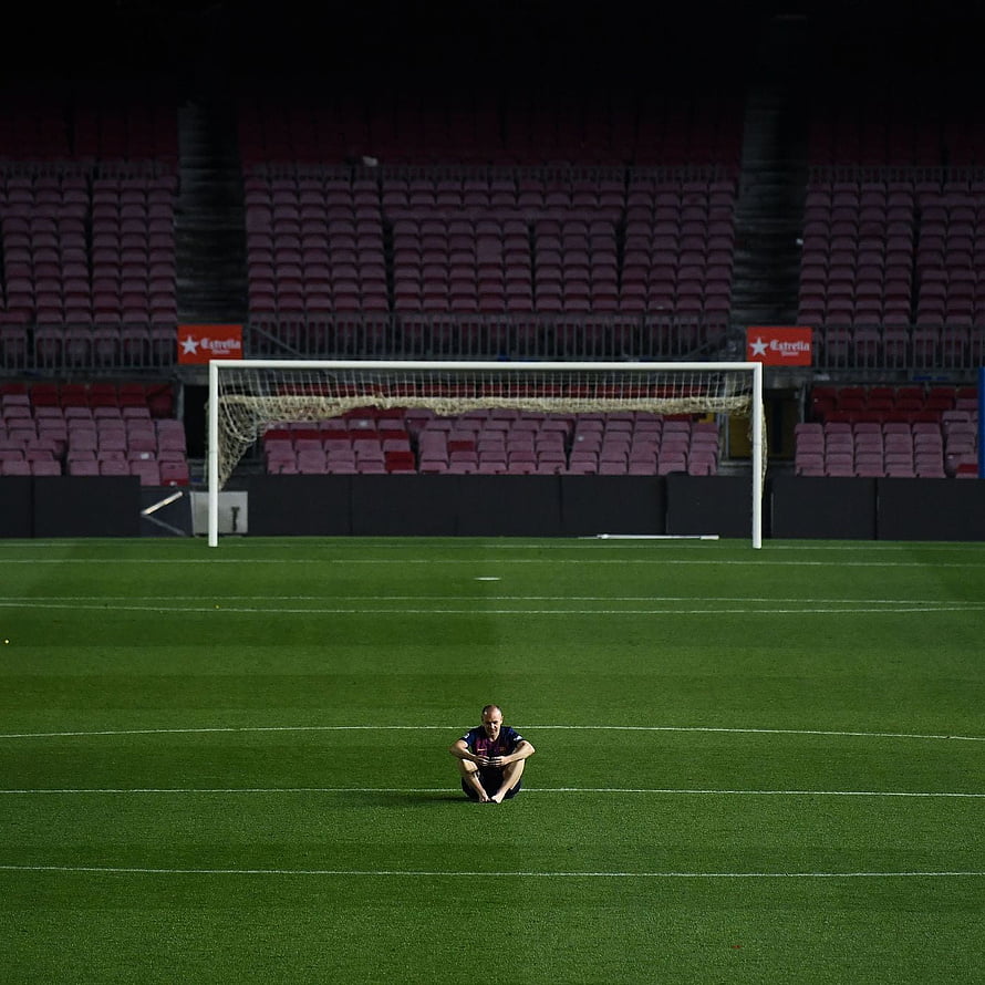 Andres Iniesta Sitting Alone on the Pitch at Camp Nou Stadium HD phone wallpaper