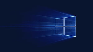 Windows 10 Glowing Blue Window Logo on Dark Background with Light Rays HD wallpaper
