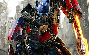 Optimus Prime Wielding Energy Blade in Urban Battlefield from Transformers Film HD wallpaper