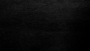 Dark Textured Black Leather Surface with Subtle Grain and Wrinkles HD wallpaper