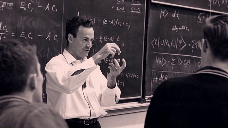 Richard Feynman Explaining Quantum Mechanics at a Blackboard in a Classic Lecture HD wallpaper