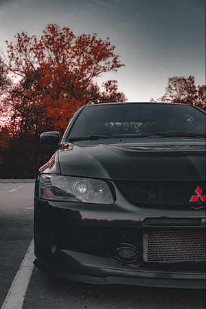 Black Mitsubishi Lancer Evolution Front View With Intercooler And Autumn Trees HD phone wallpaper