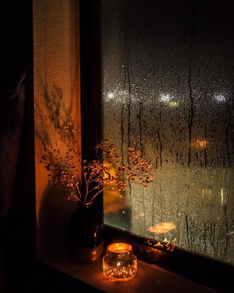 Cozy Night Aesthetic with Candlelight and Rainy Window View HD phone wallpaper