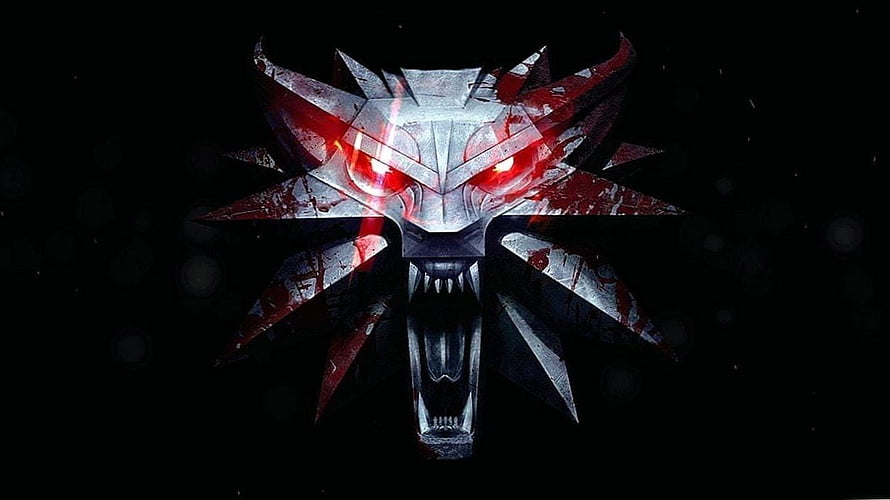 The Witcher 3 Wolf Medallion Emblem with Glowing Red Eyes on Black Background HD wallpaper