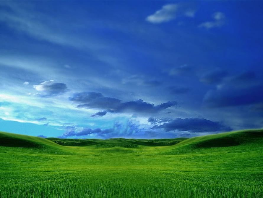 Vast Green Rolling Hills Under a Dramatic Blue Sky with Scattered Clouds HD wallpaper